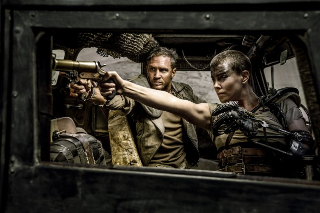 For Editorial Use Mandatory Credit: Photo by Jasin Boland/THA/REX/Shutterstock (15063169h) (L-r) TOM HARDY as Max Rockatansky and CHARLIZE THERON as Imperator Furiosa in Warner Bros. Pictures' and Village Roadshow Pictures' action adventure "MAD MAX: FURY ROAD," a Warner Bros. Pictures release. "Mad Max: Fury Road" (2015)