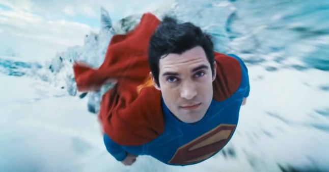 A still of David Corenswet as Superman flying in the trailer