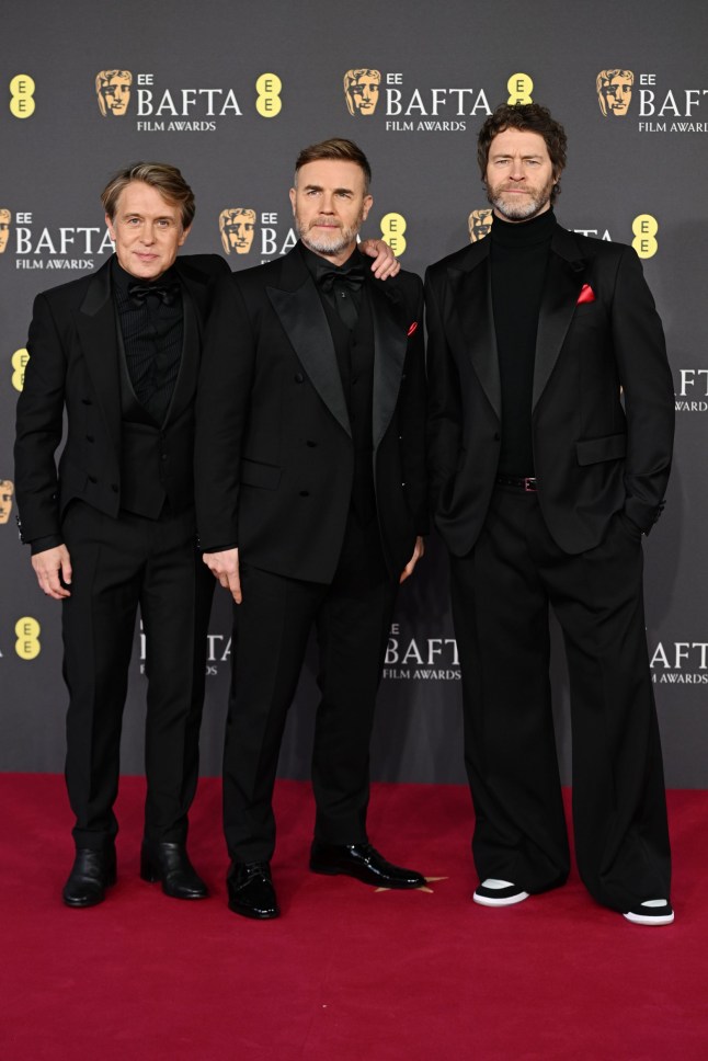 LONDON, ENGLAND - FEBRUARY 16: (L-R) Mark Owen, Gary Barlow and Howard Donald of Take That attend the EE BAFTA Film Awards 2025 at The Royal Festival Hall on February 16, 2025 in London, England. (Photo by Kate Green/Getty Images)
