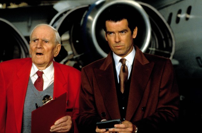 Editorial use only. No book cover usage. Mandatory Credit: Photo by Moviestore/REX/Shutterstock (1646595a) Tomorrow Never Dies (James Bond), Desmond Llewelyn, Pierce Brosnan Film and Television