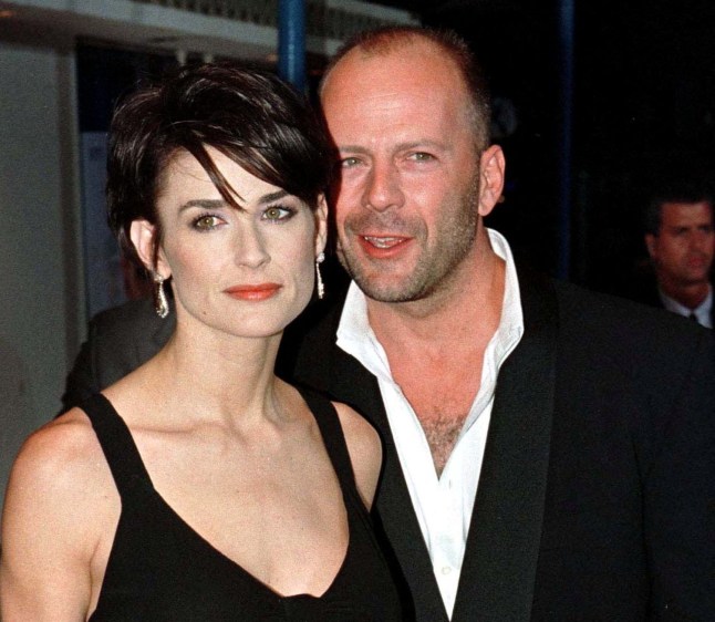 FILE PHOTO: Actress Demi Moore, star of the new film "G.I. Jane", arrives for the film's premiere with husband Bruce Willis August 6 1997 in Los Angeles./File Photo