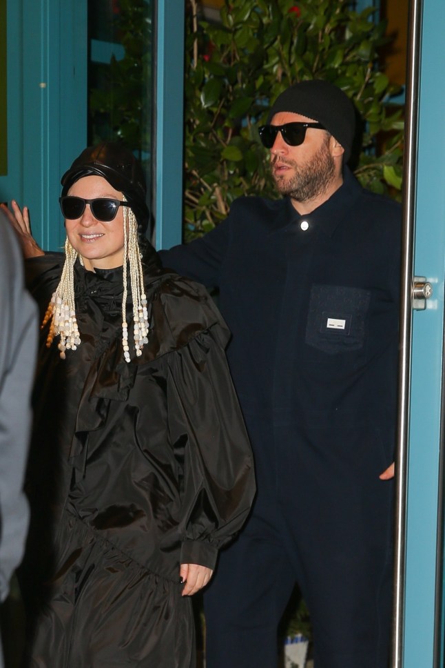 New York, NY - *EXCLUSIVE* - Sia steps out with her husband, Dan Bernard, for a day out in New York. The singer wears a very chic look with a black Prada outfit, combining style and comfort. Pictured: Sia, Dan Bernard BACKGRID USA 27 FEBRUARY 2025 BYLINE MUST READ: Fernando Ramales / BACKGRID USA: +1 310 798 9111 / usasales@backgrid.com UK: +44 208 344 2007 / uksales@backgrid.com *UK Clients - Pictures Containing Children Please Pixelate Face Prior To Publication*