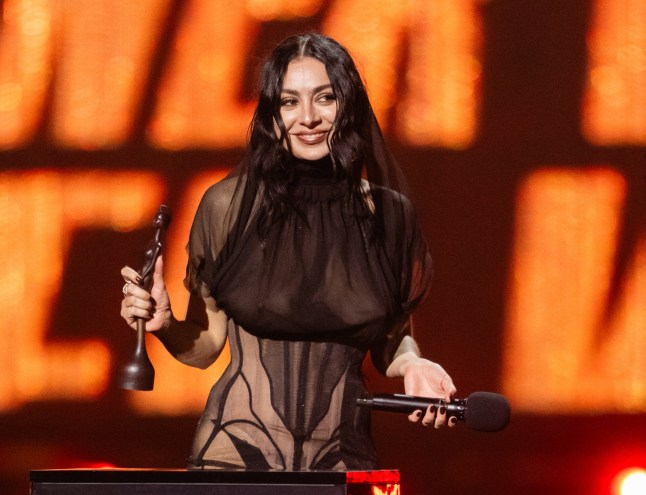 LONDON, ENGLAND - MARCH 01: (EDITORIAL USE ONLY) Charli XCX after winning the Artist Of The Year award on stage during The BRIT Awards 2025 at The O2 Arena on March 01, 2025 in London, England. (Photo by Samir Hussein/WireImage)