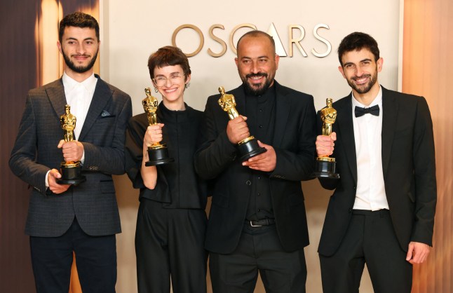 Basel Adra, Rachel Szor, Hamdan Ballal and Yuval Abraham pose with the Oscar for Best Documentary Feature Film for "No Other Land" in the Oscars photo room at the 97th Academy Awards in Hollywood, Los Angeles, California, U.S., March 2, 2025. REUTERS/Daniel Cole