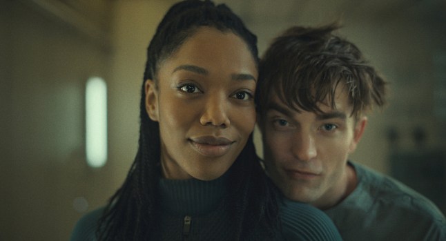 Undated film still from Mickey 17. Pictured: Naomi Ackie as Nasha and Robert Pattinson as Mickey 17. See PA Feature SHOWBIZ Film Reviews. WARNING: This picture must only be used to accompany PA Feature SHOWBIZ Film Reviews. PA Photo. Picture credit should read: Warner Bros. Entertainment Inc. All Rights Reserved. NOTE TO EDITORS: This picture must only be used to accompany PA Feature SHOWBIZ Film Reviews.
