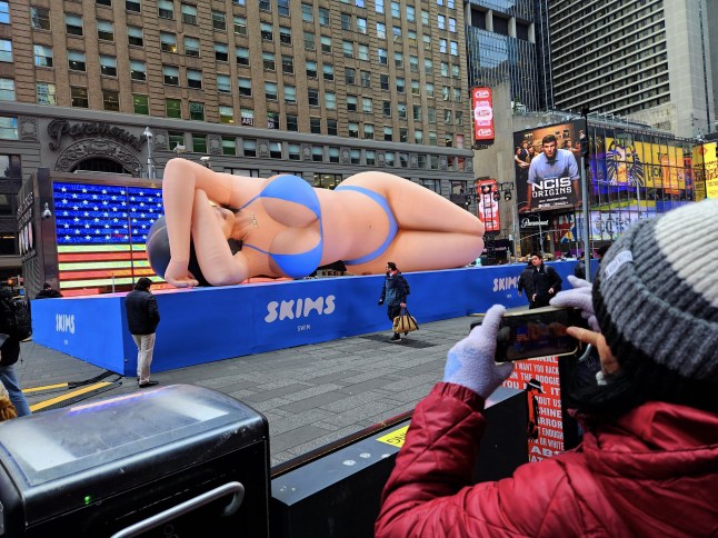 Mandatory Credit: Photo by Guerin Charles/ABACA/Shutterstock (15179745f) 60-foot balloon of Kim Kardashian to promote Skims new swim in Times Square, New York on March 4, 2025. Kim Kardashian Balloon in Times Square - NYC, New York City, United States - 04 Mar 2025