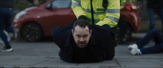 Danny Dyer as Jack is held on the road as he's arrested in a scene from Marching Powder