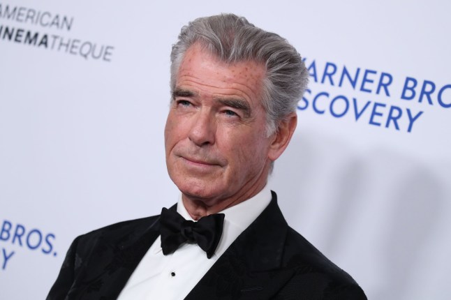Pierce Brosnan in black tie on a red carpet