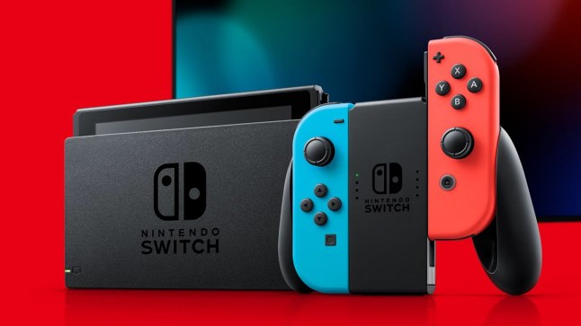 Nintendo Switch with red and blue Joy-Con controllers in front of TV