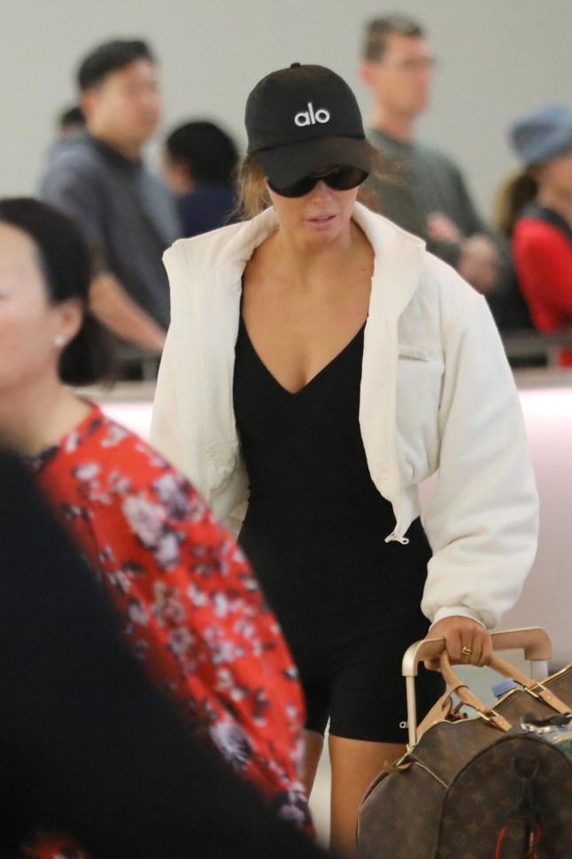 Los Angeles, CA - Maura Higgins escapes to LA after that "kissing scandal" after she was reportedly filmed kissing married singer, Danny Jones. The Irish TV presenter showed off her incredible body in a one-piece outfit, ALO Yoga hat and socks with a white jacket as she arrived at LAX with a friend. Pictured: Maura Higgins BACKGRID USA 9 MARCH 2025 BYLINE MUST READ: LionsShareNews / BACKGRID USA: +1 310 798 9111 / usasales@backgrid.com UK: +44 208 344 2007 / uksales@backgrid.com *UK Clients - Pictures Containing Children Please Pixelate Face Prior To Publication*