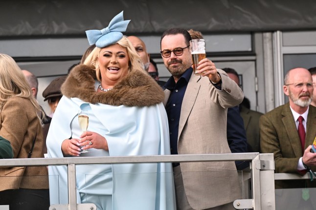 Danny Dyer and Gemma Collins raise a glass at photographers at St Patrick's Thursday - Day 3 of the Cheltenham Festival 2025.