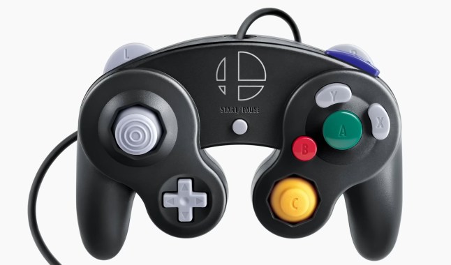 Black Nintendo GameCube controller with the Super Smash Bros. logo on it