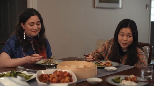 A still from The Wedding Banquet with Kelly Marie Tran and Lily Gladstone as Lee and Angela