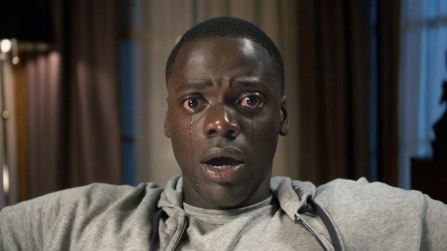 Daniel Kaluuya as Chris in Get Out. He is staring at the camera appearing shocked with tears rolling down his face