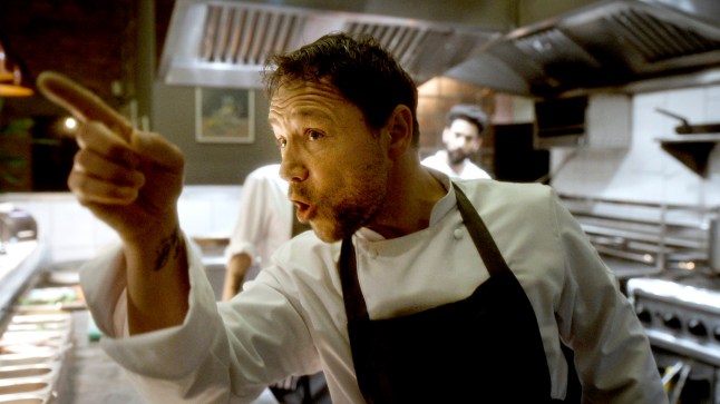 Stephen Graham in chef's whites points fiercely in a still from the film Boiling Point