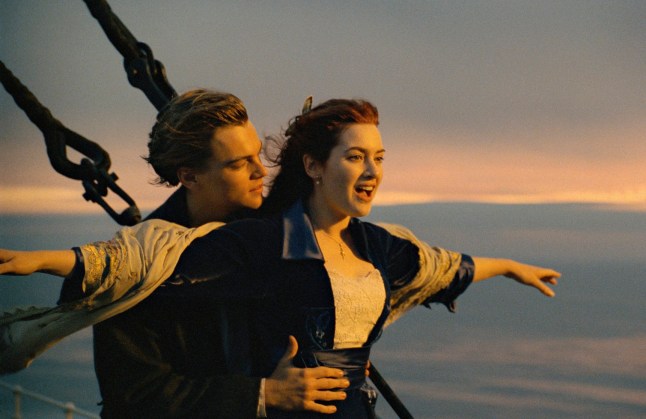 Leonardo DiCaprio as Jack holds Kate Winslet as Rose at the front of the boat in a scene from Titanic