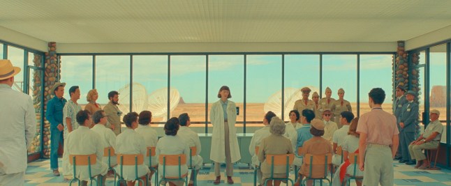 Film handout: Asteroid City (L to R) Rupert Friend as "Montana", Stephen Park as "Roger Cho", Hope Davis as "Sandy Borden", Jason Schwartzman as "Augie Steenbeck", Tilda Swinton as "Dr. Hickenlooper", Jeffrey Wright as "General Gibson", Tony Revolori as "Aide-de-Camp", Bob Balaban as "Larkings Executive", Mike Maggart as "Detective #2", Fisher Stevens as "Detective #1" in writer/director Wes Anderson's ASTEROID CITY, a Focus Features release. Credit: Courtesy of Pop. 87 Productions/Focus Features