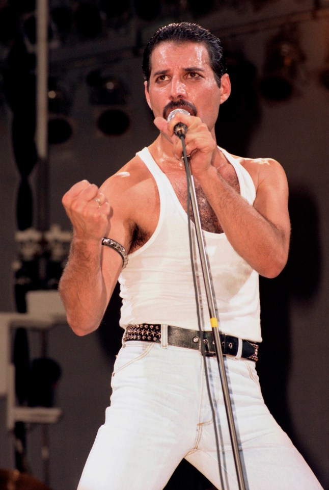 UNITED KINGDOM - JULY 13: WEMBLEY STADIUM Photo of Freddie MERCURY and LIVE AID and QUEEN, Freddie Mercury performing live on stage at Live Aid (Photo by Phil Dent/Redferns)