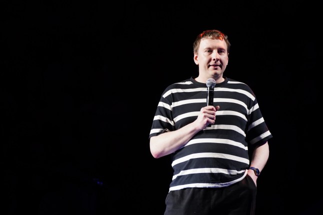 Joe Lycett on stage during A Night of Comedy, the Teenage Cancer Trust show at the Royal Albert Hall, London. Picture date: Tuesday March 19, 2024. PA Photo. See PA story SHOWBIZ TCT. Photo credit should read: Ian West/PA Wire