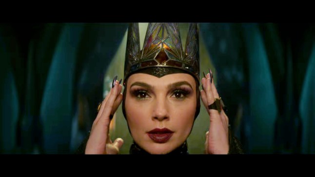 LIGHTENED - Disney has unveiled a first look at the upcoming live-action remake of ?Snow White.? In a new image, Rachel Zegler is transformed into the iconic Disney Princess, surrounded by her Seven Dwarfs. As of today, the film, which was originally set to open on March 22, 2024, has been delayed to March 21, 2025. Zegler stars as Snow White and Gal Gadot plays The Evil Queen. Ansu Kabia co-stars as the Huntsman and Andrew Burnap plays a new character named Jonathan. The Seven Dwarfs have been reimagined for the remake, and Zegler has said that this new iteration will not be as focused on the romantic subplot but instead will show Snow White become the leader her father encouraged her to be. The reimagined storyline and Zegler?s casting ? she will be the first Latina to play Snow White ? have generated some online criticism for veering from the source material.