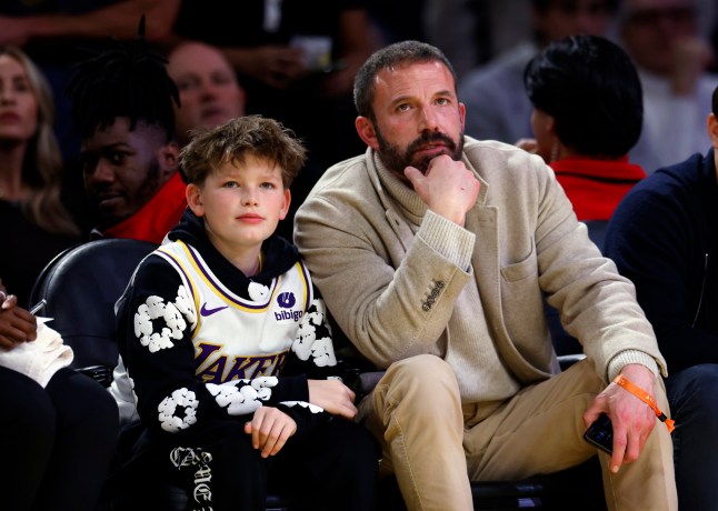 Actor Ben Affleck, right, and his son, left, attend an NBA basketball game between the Los Angeles Lakers and the Golden State Warriors during the first half Thursday, Feb. 6, 2025, in Los Angeles. (AP Photo/Kevork Djansezian)