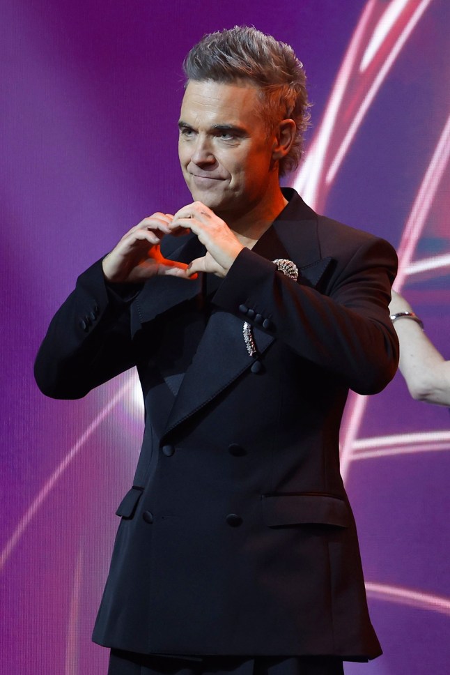 GOLD COAST, AUSTRALIA - FEBRUARY 07: Robbie Williams speaks onstage as "Better Man" received an Award for Best Film during the 2025 AACTA Awards Presented By Foxtel Group at HOTA (Home of the Arts) on February 07, 2025 in Gold Coast, Australia. (Photo by Mackenzie Sweetnam/Getty Images)