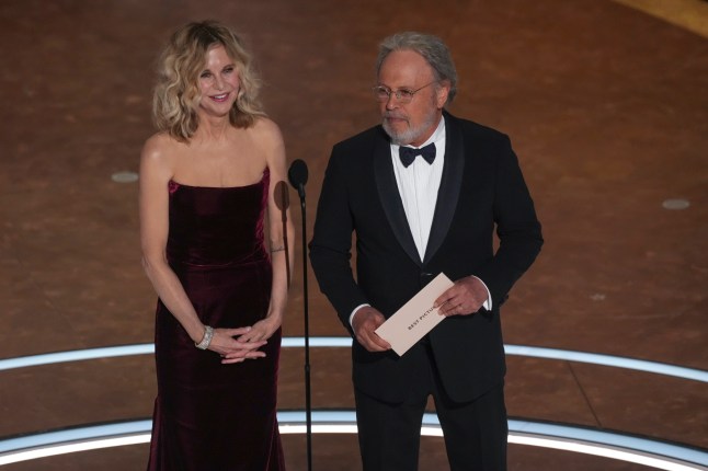 Meg Ryan, left, and Billy Crystal present the award for best picture during the Oscars on Sunday, March 2, 2025, at the Dolby Theatre in Los Angeles. (AP Photo/Chris Pizzello)