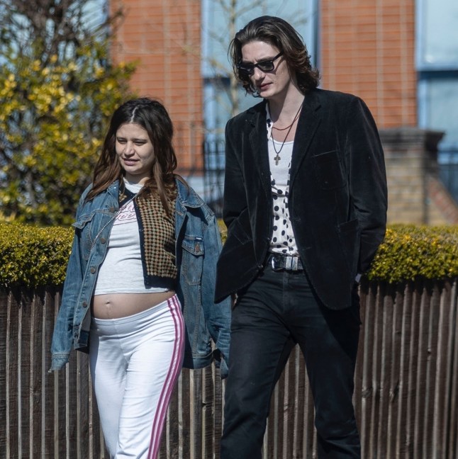 BGUK_3188302 - *PREMIUM-EXCLUSIVE* London, UNITED KINGDOM - MUST CALL FOR PRICING BEFORE USAGE - The daughter of the late INXS frontman Michael Hutchence and the late British television presenter Paula Yates, Tiger Lily Hutchence and boyfriend Ben Archer are seen strolling through London enjoying the spring sunshine. Showing off her blossoming baby bump out in the spring-like conditions Tiger Lily is expecting her first child with Ben after dating the British model Ben since June 2023. Tiger went casual during the jaunt wearing her denim jacket, top and joggers and went stylish wearing her designer Vivienne Westwood handbag. Pictured: Tiger Lily - Ben Archer BACKGRID UK 24 MARCH 2025 UK: +44 208 344 2007 / uksales@backgrid.com USA: +1 310 798 9111 / usasales@backgrid.com *Pictures Containing Children Please Pixelate Face Prior To Publication*