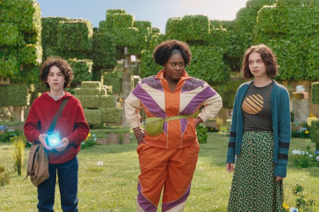 This image released by Warner Bros. Pictures shows, from left, Sebastian Hansen, Danielle Brooks and Emma Myers in a scene from "A Minecraft Movie." (Warner Bros. Pictures via AP)