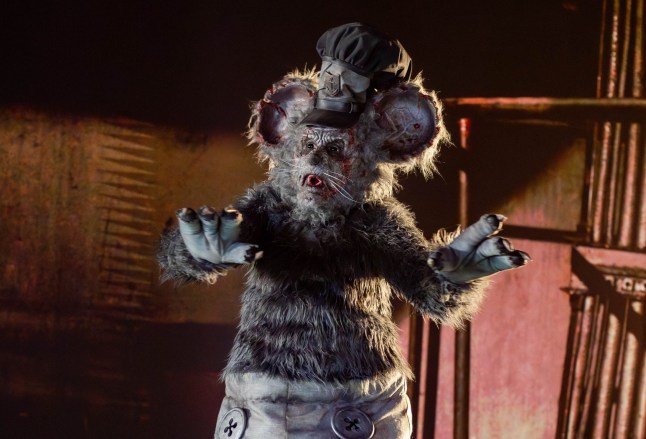 David Howard Thornton as Willie with his arms raised and in Mickey Mouse's recognisable guise, in Screamboat