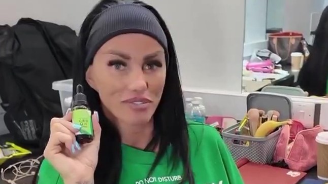 Katie Price holds up CBD oil