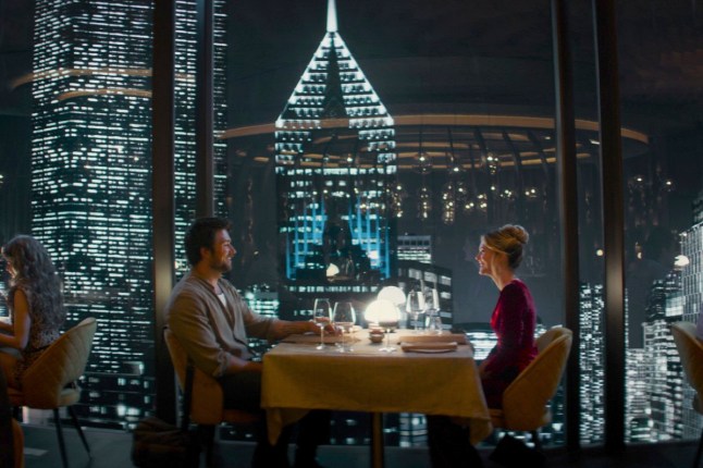 This image released by Universal Pictures shows Brandon Sklenar, left, and Meghann Fahy in a scene from "Drop." (Universal Pictures via AP)