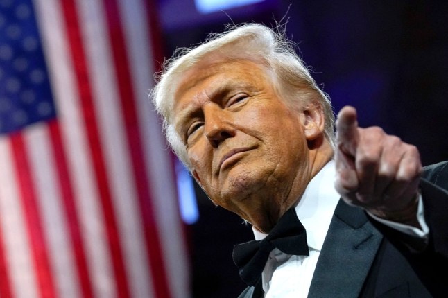 U.S. President Donald Trump gestures as he attends the National Republican Congressional Committee (NRCC) dinner at the National Building Museum in Washington, D.C., U.S., April 8, 2025. REUTERS/Nathan Howard