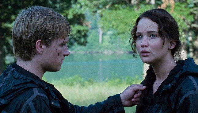 Peeta touching Katniss's hair in Hunger Games