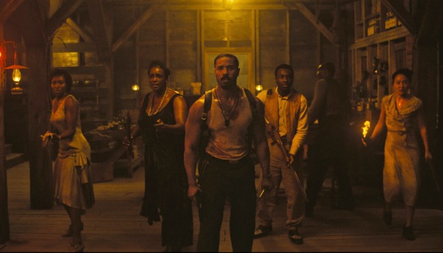 This image released by Warner Bros Pictures shows Michael B. Jordan, center, in a scene from "Sinners." (Warner Bros. Pictures via AP)