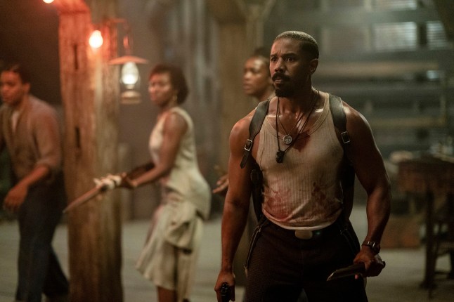 This image released by Warner Bros Pictures shows Michael B. Jordan, right, in a scene from "Sinners." (Warner Bros. Pictures via AP)