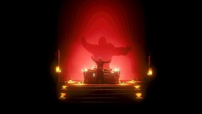 Metro Awakening man standing in front of altar under a red spotlight