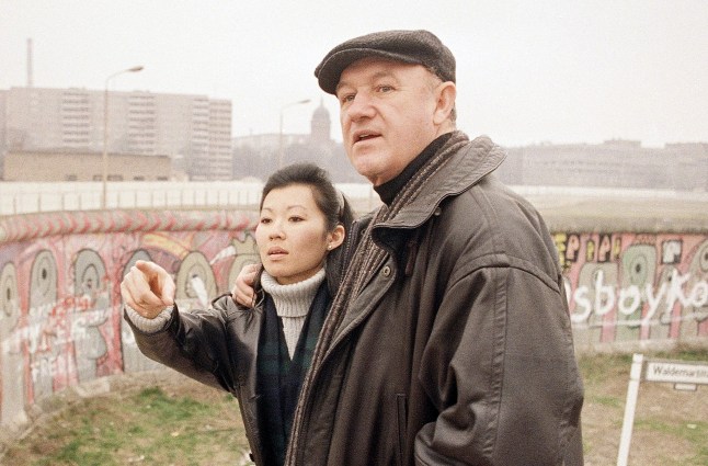 Famous American actor Gene Hackman, right, and his companion Betsy Arakawa take a look over Berlin Wall