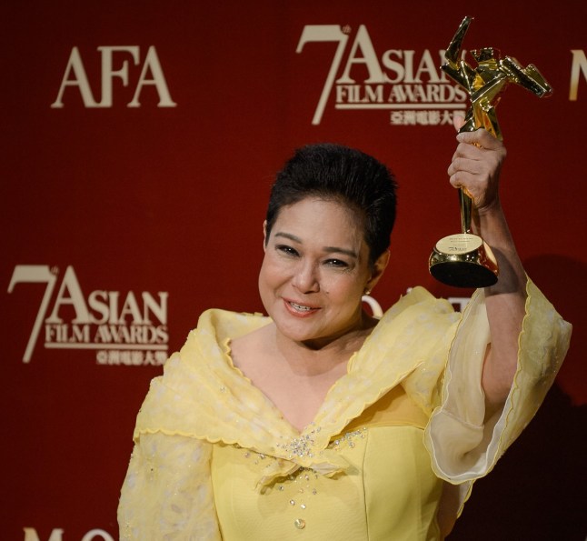 Actress Nora Aunor of the Philippines, poses with the Best Actress award at the 7th Asian Film Awards in Hong Kong on March 18, 2013. The Asian Film Awards, organised by the Hong Kong International Film Festival and held annually since 2007, are aimed at showcasing the region's movie talent. AFP PHOTO / Philippe Lopez (Photo credit should read PHILIPPE LOPEZ/AFP via Getty Images)