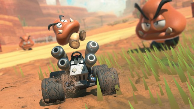 A Goomba hopping above its kart in Mario Kart World