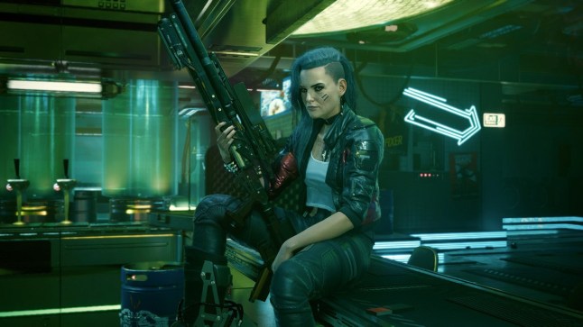 Cyberpunk 2077 woman sat on edge of table holding a large gun
