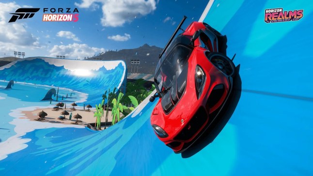 Forza Horizon 5 a red car driving up a blue racetrack by the seaside