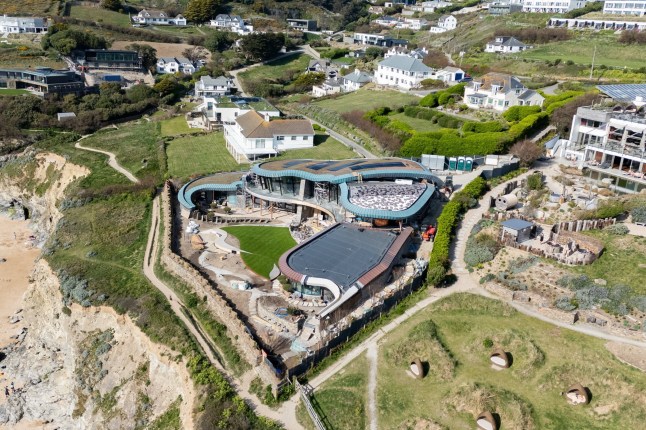 The spectacular new home being built in Mawgan Porth, Cornwall. Photo released April 24 2025. These pictures show the stunning transformation of a Cornish coastal village dubbed 'Hollywood-on-Sea' - including a stunning eco-home and Cate Blanchett's new mansion. The stretch of properties along the seafront in Mawgan Porth features a series of multi-million pound developments that have attracted the rich and famous. They have been heralded by some for their 'futuristic' designs - despite fears locals in Cornwall are being priced out of the area. At the heart of the cliff-top scene is a five-bed eco-home being built by the Hollywood actress after she got planning permission to knock down the ??1.6M cottage she bought with her playwright husband Andrew Upton.