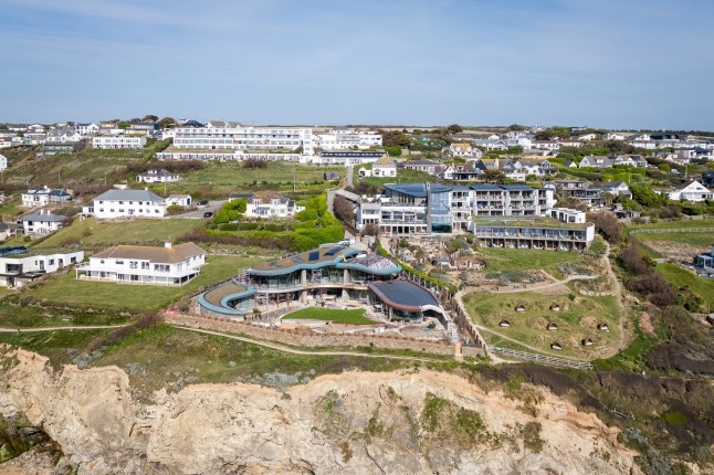 The spectacular new home being built in Mawgan Porth, Cornwall. Photo released April 24 2025. These pictures show the stunning transformation of a Cornish coastal village dubbed 'Hollywood-on-Sea' - including a stunning eco-home and Cate Blanchett's new mansion. The stretch of properties along the seafront in Mawgan Porth features a series of multi-million pound developments that have attracted the rich and famous. They have been heralded by some for their 'futuristic' designs - despite fears locals in Cornwall are being priced out of the area. At the heart of the cliff-top scene is a five-bed eco-home being built by the Hollywood actress after she got planning permission to knock down the ??1.6M cottage she bought with her playwright husband Andrew Upton.