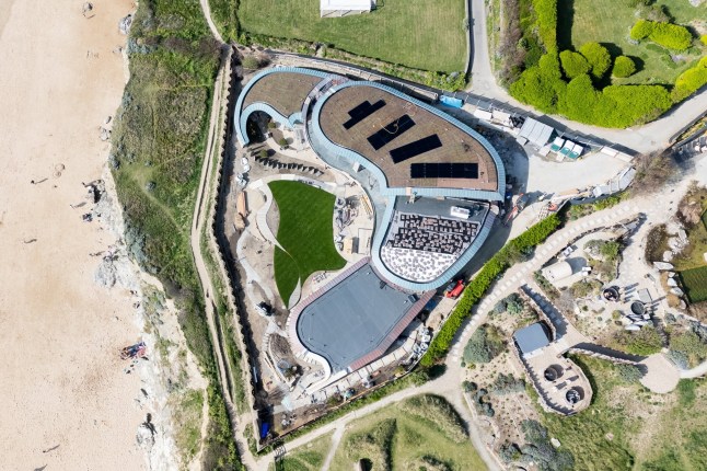 The spectacular new home being built in Mawgan Porth, Cornwall. Photo released April 24 2025. These pictures show the stunning transformation of a Cornish coastal village dubbed 'Hollywood-on-Sea' - including a stunning eco-home and Cate Blanchett's new mansion. The stretch of properties along the seafront in Mawgan Porth features a series of multi-million pound developments that have attracted the rich and famous. They have been heralded by some for their 'futuristic' designs - despite fears locals in Cornwall are being priced out of the area. At the heart of the cliff-top scene is a five-bed eco-home being built by the Hollywood actress after she got planning permission to knock down the ??1.6M cottage she bought with her playwright husband Andrew Upton.