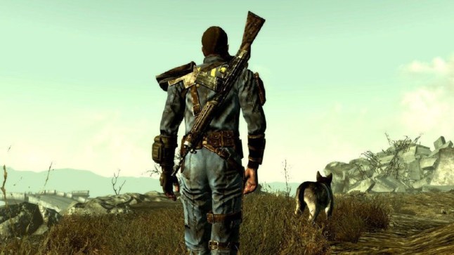 Fallout 3 player character walking through wasteland with a dog