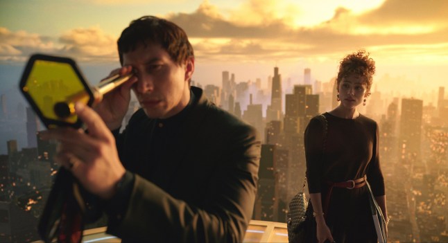 This image released by Lionsgate shows Adam Driver, left, and Nathalie Emmanuel in a scene from "Megalopolis." (Lionsgate via AP)