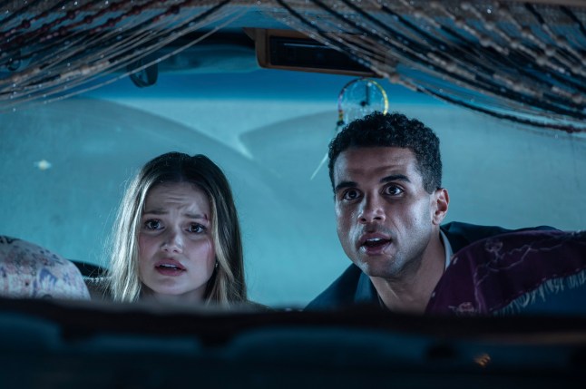This image released by Sony Pictures shows Olivia Holt, left, and Mason Gooding in Screen Gems and Spyglass Media Group's "Heart Eyes." (Christopher Moss/Sony Pictures via AP)
