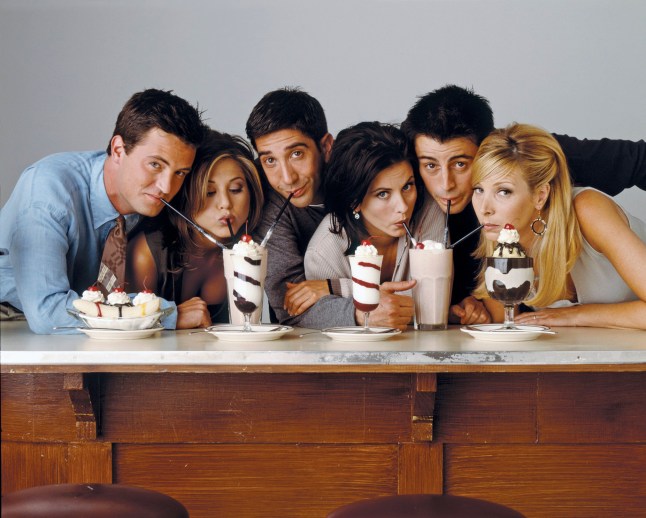 The Friends cast including Jennifer Aniston, Courteney Cox, Lisa Kudrow, Matt LeBlanc and David Schwimmer, and Matthew Perry drink milkshakes.