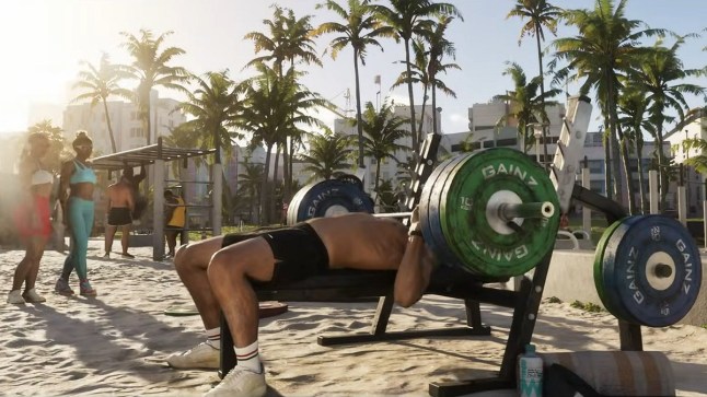 GTA 6 Jason lifting weights in a beach area while two women admire him as they walk past
